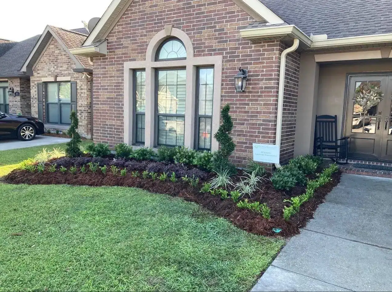Lush landscape design featuring native New Orleans plants and pathways.