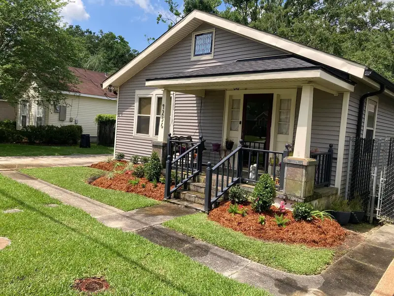 Southern Grounds LLC's landscaping work displaying a perfectly manicured garden with a mix of ornamental shrubs and flowering plants in New Orleans
