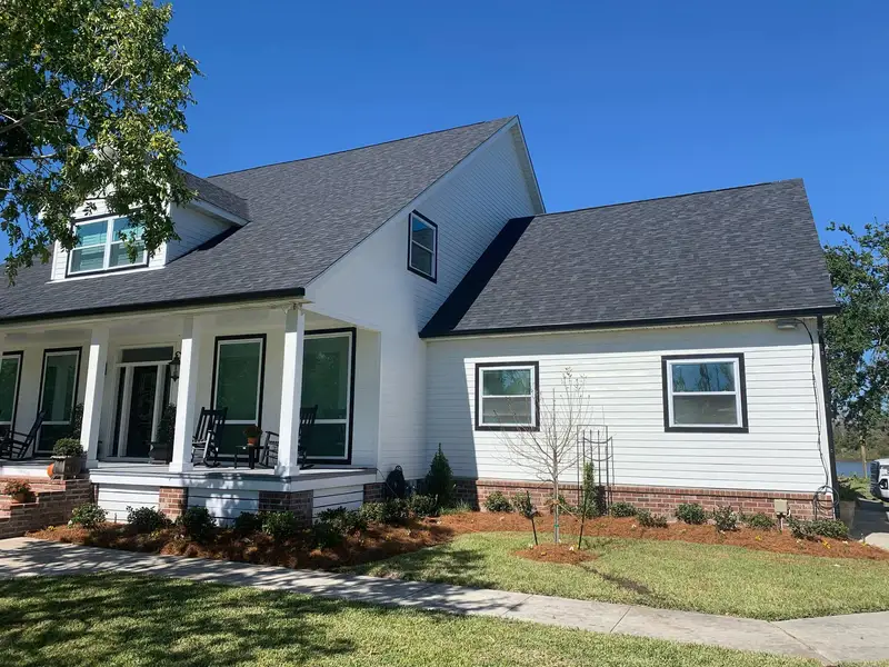 Southern Grounds LLC's landscaping work displaying a perfectly manicured garden with a mix of ornamental shrubs and flowering plants in New Orleans.