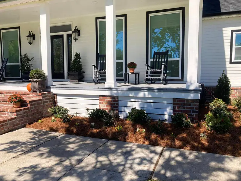 Southern Grounds LLC's landscaping work displaying a perfectly manicured garden with a mix of ornamental shrubs and flowering plants in New Orleans.