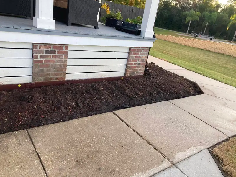 Southern Grounds LLC's landscaping work displaying a perfectly manicured garden with a mix of ornamental shrubs and flowering plants in New Orleans.