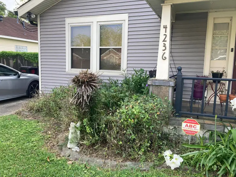 Southern Grounds LLC's landscaping work displaying a perfectly manicured garden with a mix of ornamental shrubs and flowering plants in New Orleans