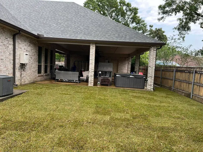 Fresh sod installation by Southern Grounds LLC, transforming a New Orleans backyard with lush, green, and healthy grass.