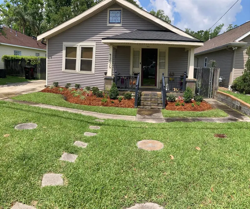 Southern Grounds LLC's landscaping work displaying a perfectly manicured garden with a mix of ornamental shrubs and flowering plants in New Orleans