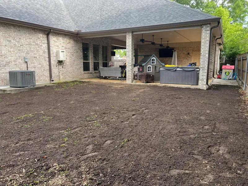 Fresh sod installation by Southern Grounds LLC, transforming a New Orleans backyard with lush, green, and healthy grass.