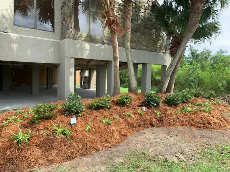 Beautiful landscaping flowerbeds with mulch crafted and installed by Southern Grounds, LLC in the greater new orleans area