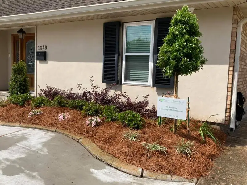 Beautiful landscaping flowerbeds with mulch crafted and installed by Southern Grounds, LLC in the greater new orleans area