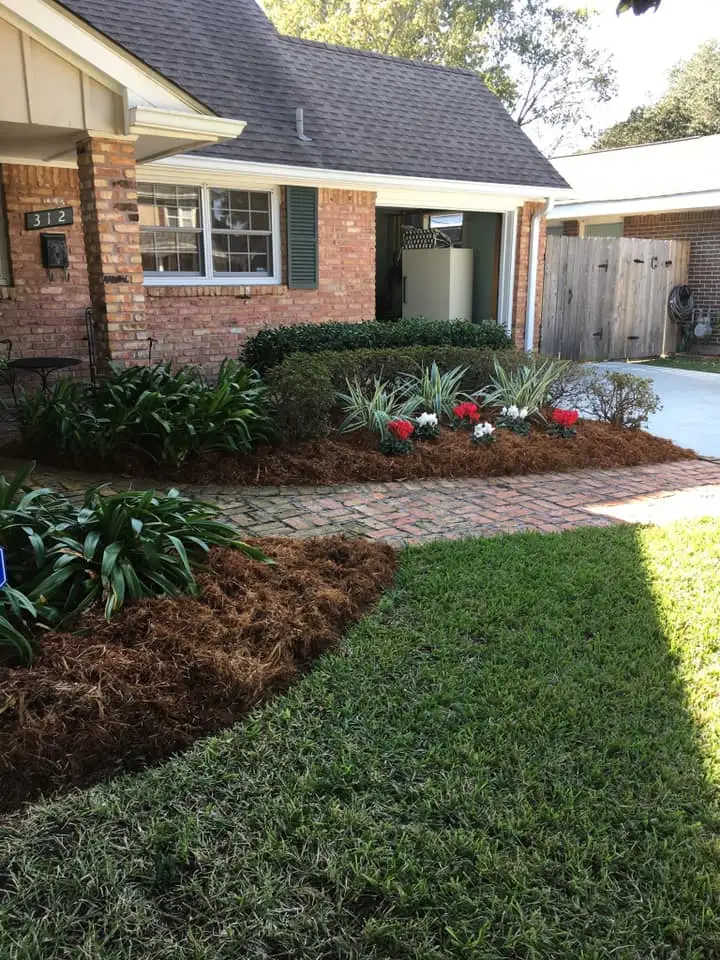 Beautiful landscaping flowerbeds with mulch crafted and installed by Southern Grounds, LLC in the greater new orleans area