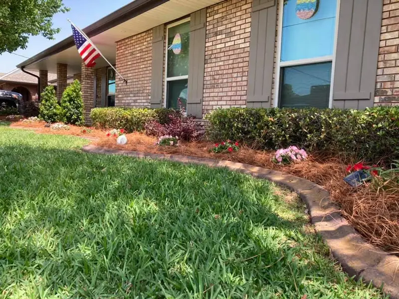 Beautiful landscaping flowerbeds with mulch crafted and installed by Southern Grounds, LLC in the greater new orleans area