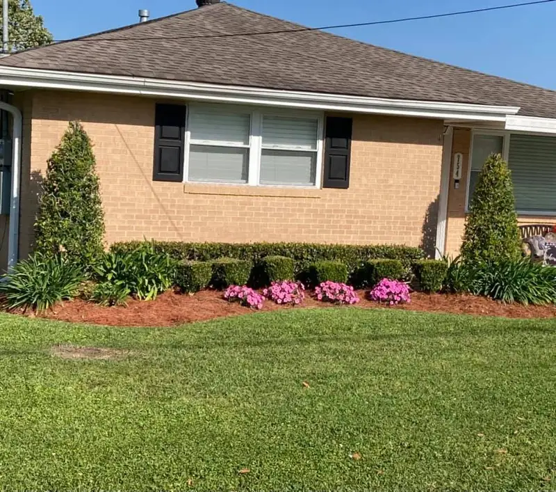 Beautiful landscaping flowerbeds with mulch crafted and installed by Southern Grounds, LLC in the greater new orleans area