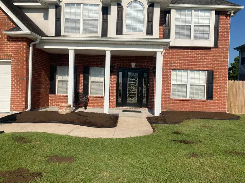 Beautiful landscaping flowerbeds with mulch crafted and installed by Southern Grounds, LLC in the greater new orleans area
