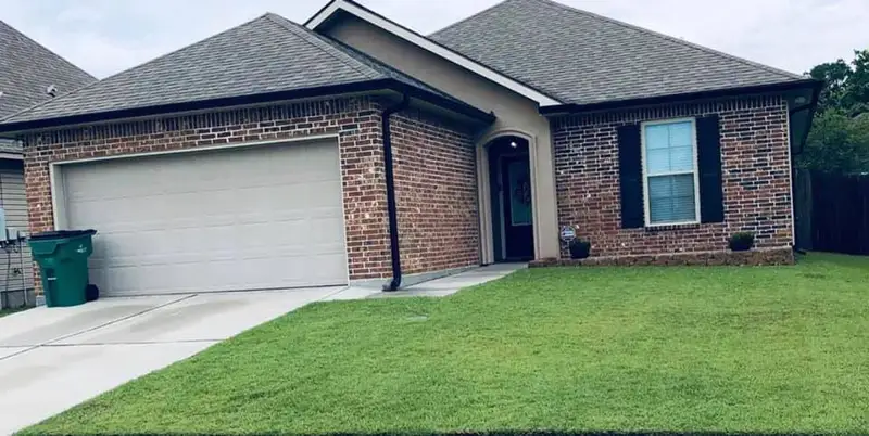 Beautiful landscaping flowerbeds with mulch crafted and installed by Southern Grounds, LLC in the greater new orleans area