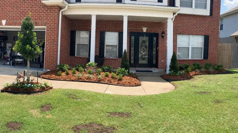 Beautiful landscaping flowerbeds with mulch crafted and installed by Southern Grounds, LLC in the greater new orleans area