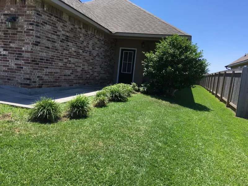 Beautiful landscaping flowerbeds with mulch crafted and installed by Southern Grounds, LLC in the greater new orleans area
