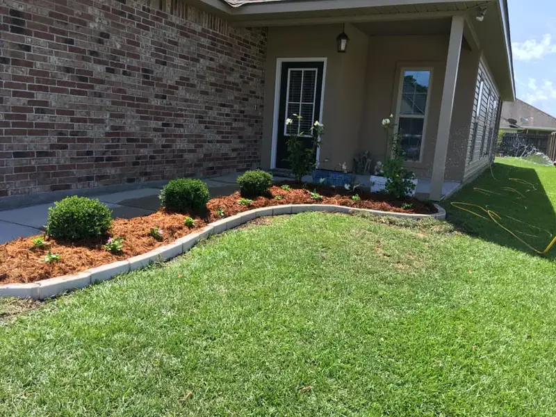 Beautiful landscaping flowerbeds with mulch crafted and installed by Southern Grounds, LLC in the greater new orleans area