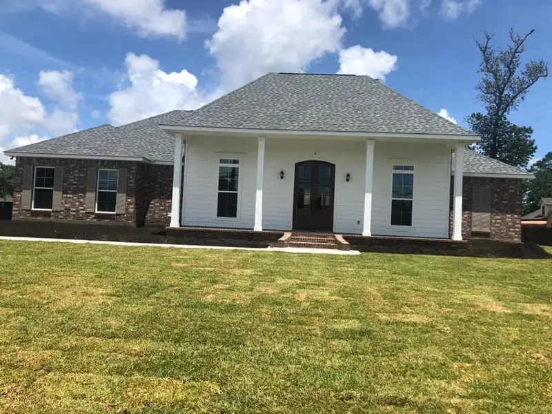 Beautiful landscaping flowerbeds with mulch crafted and installed by Southern Grounds, LLC in the greater new orleans area