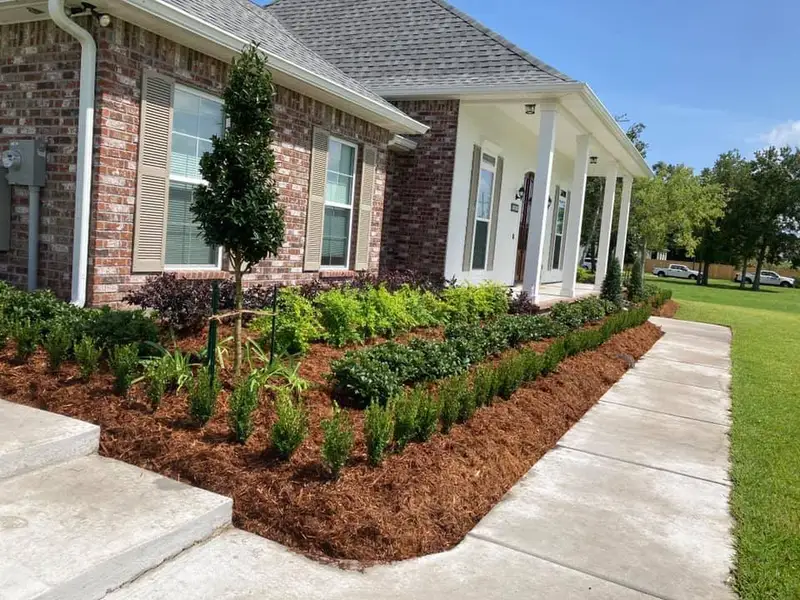 Beautiful landscaping flowerbeds with mulch crafted and installed by Southern Grounds, LLC in the greater new orleans area