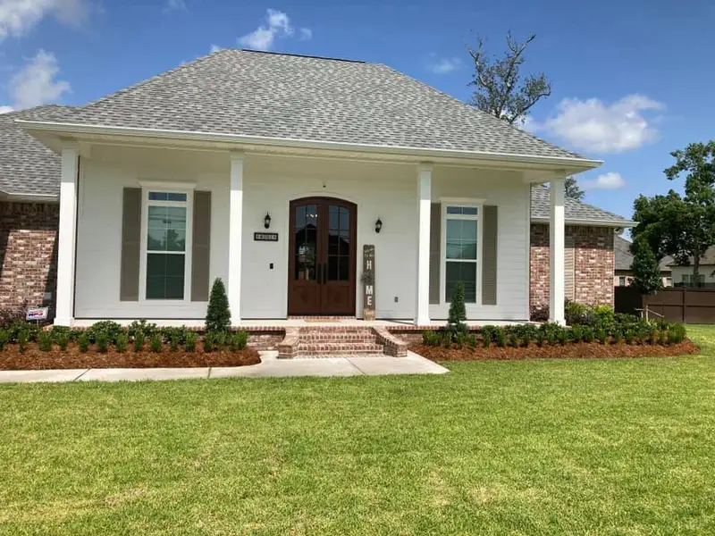 Beautiful landscaping flowerbeds with mulch crafted and installed by Southern Grounds, LLC in the greater new orleans area