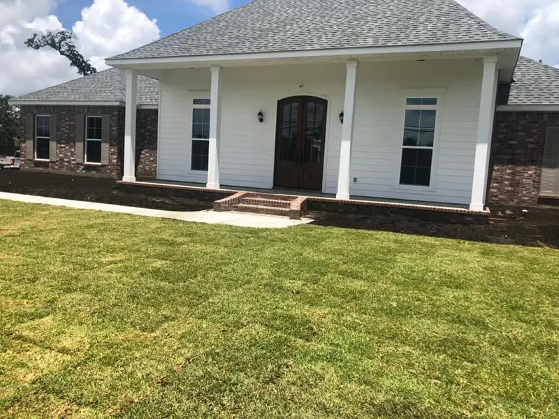 Beautiful landscaping flowerbeds with mulch crafted and installed by Southern Grounds, LLC in the greater new orleans area