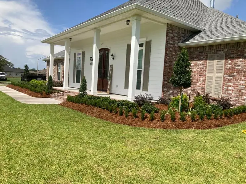Beautiful landscaping flowerbeds with mulch crafted and installed by Southern Grounds, LLC in the greater new orleans area