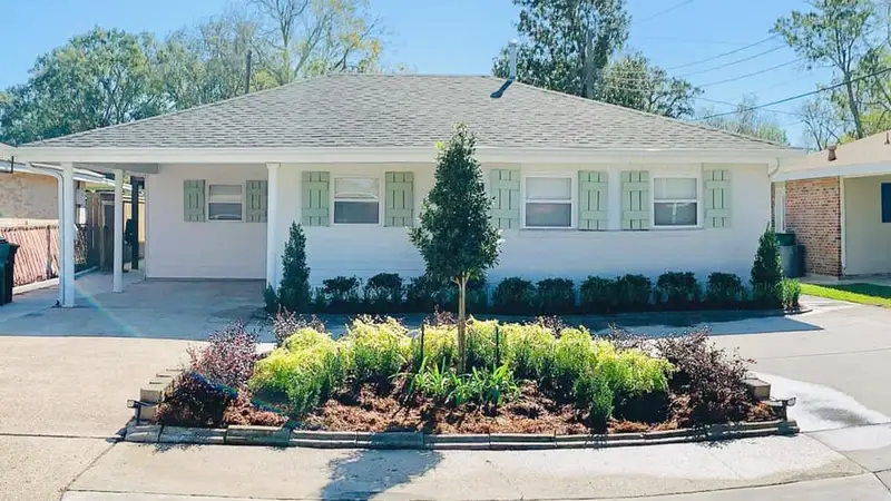 Beautiful landscaping flowerbeds with mulch crafted and installed by Southern Grounds, LLC in the greater new orleans area
