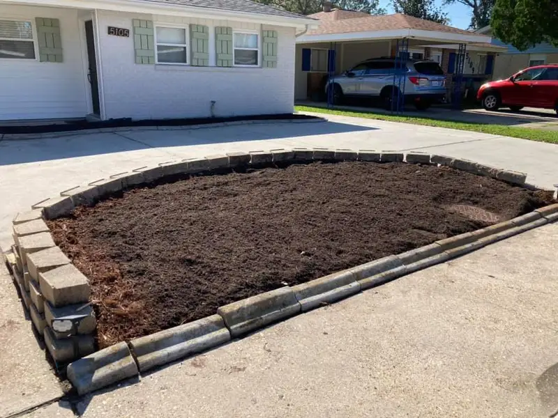 Beautiful landscaping flowerbeds with mulch crafted and installed by Southern Grounds, LLC in the greater new orleans area