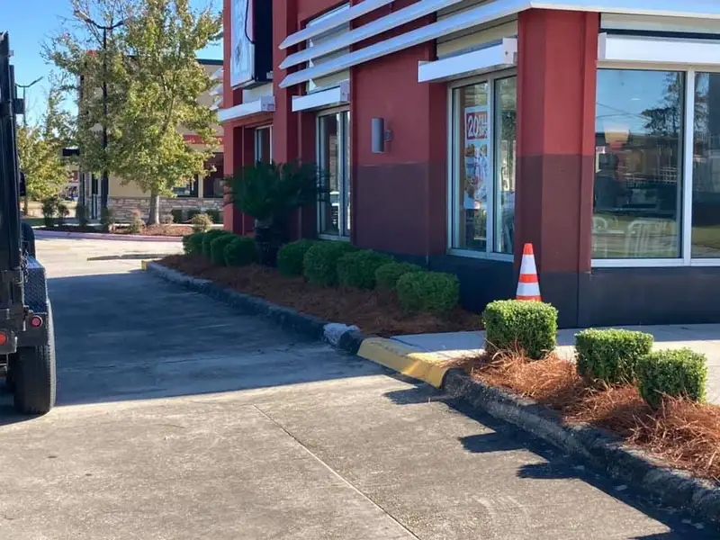 Beautiful landscaping flowerbeds with mulch crafted and installed by Southern Grounds, LLC in the greater new orleans area
