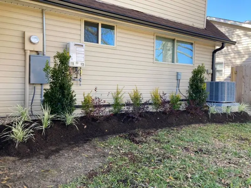 Beautiful landscaping flowerbeds with mulch crafted and installed by Southern Grounds, LLC in the greater new orleans area