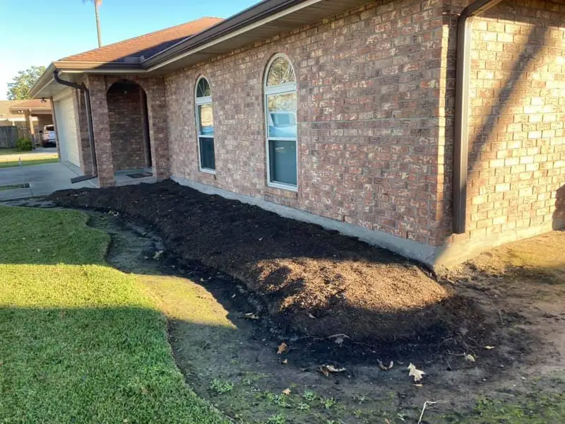 Beautiful landscaping flowerbeds with mulch crafted and installed by Southern Grounds, LLC in the greater new orleans area