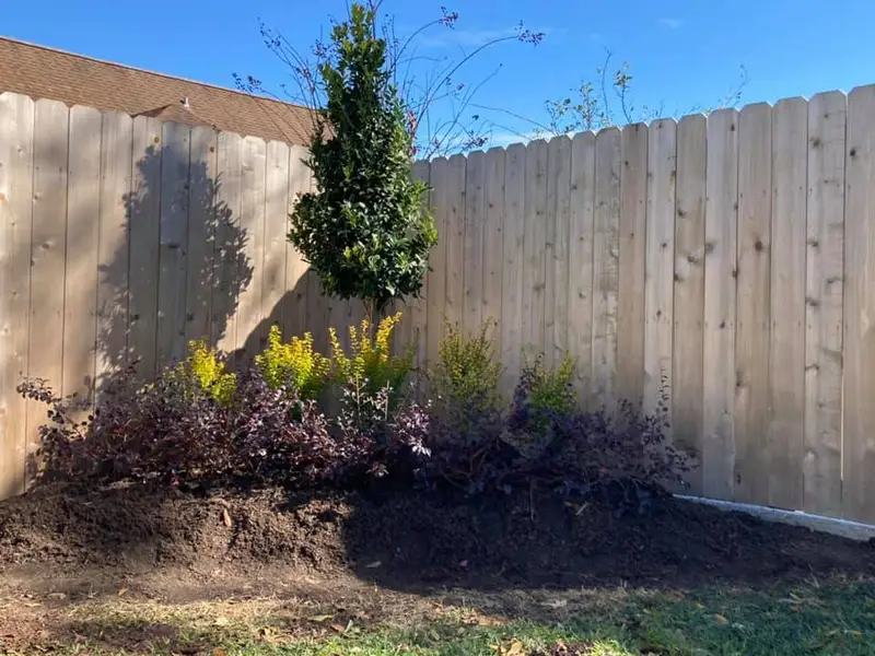 Beautiful landscaping flowerbeds with mulch crafted and installed by Southern Grounds, LLC in the greater new orleans area