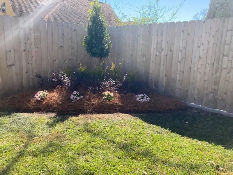 Beautiful landscaping flowerbeds with mulch crafted and installed by Southern Grounds, LLC in the greater new orleans area