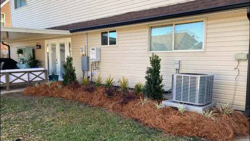 Beautiful landscaping flowerbeds with mulch crafted and installed by Southern Grounds, LLC in the greater new orleans area