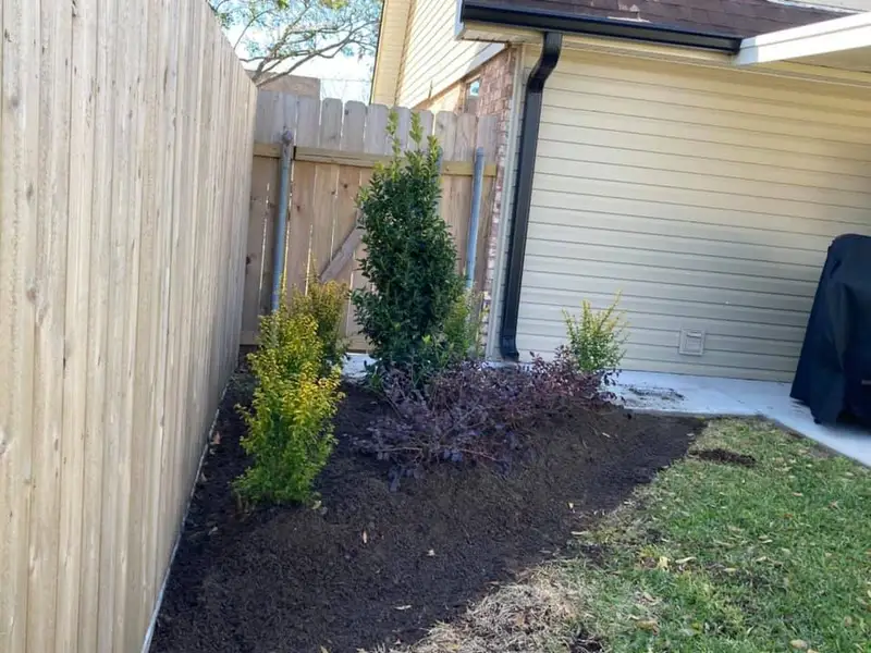 Beautiful landscaping flowerbeds with mulch crafted and installed by Southern Grounds, LLC in the greater new orleans area
