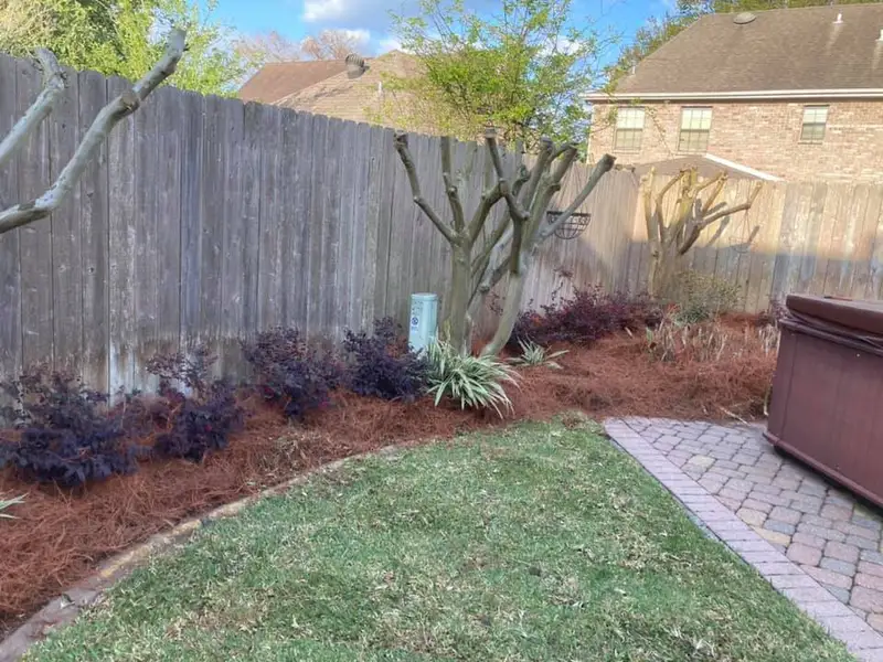 Beautiful landscaping flowerbeds with mulch crafted and installed by Southern Grounds, LLC in the greater new orleans area