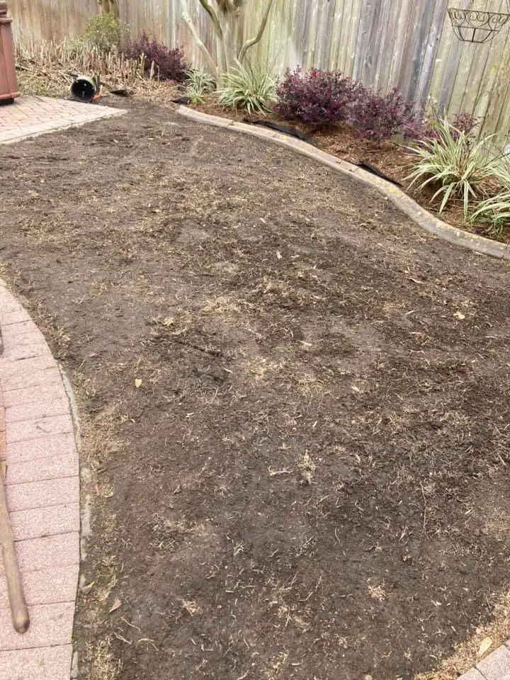 Beautiful landscaping flowerbeds with mulch crafted and installed by Southern Grounds, LLC in the greater new orleans area