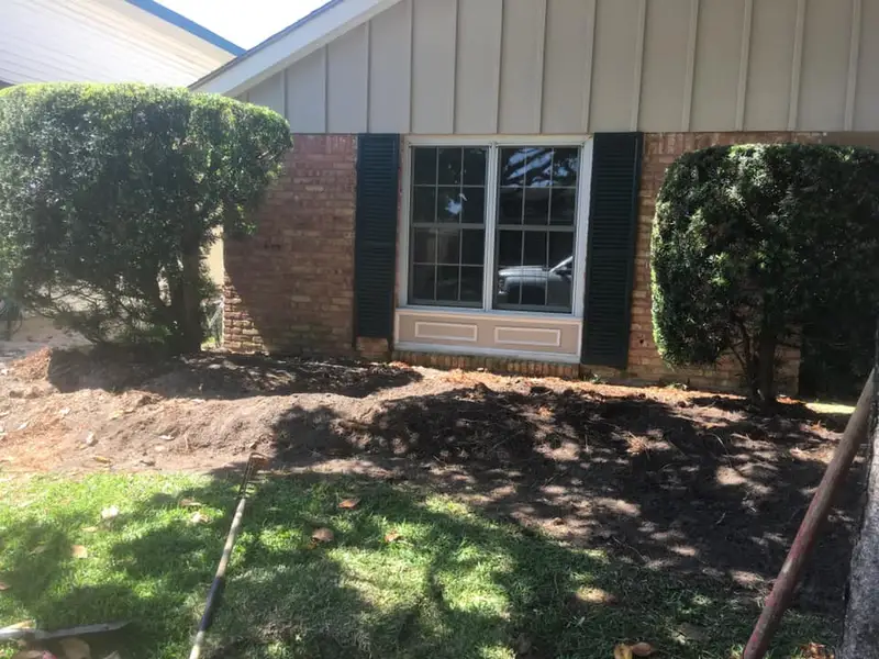 Beautiful landscaping flowerbeds with mulch crafted and installed by Southern Grounds, LLC in the greater new orleans area