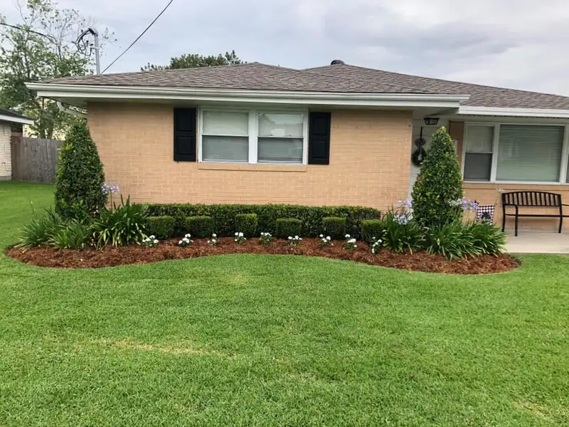Beautiful landscaping flowerbeds with mulch crafted and installed by Southern Grounds, LLC in the greater new orleans area