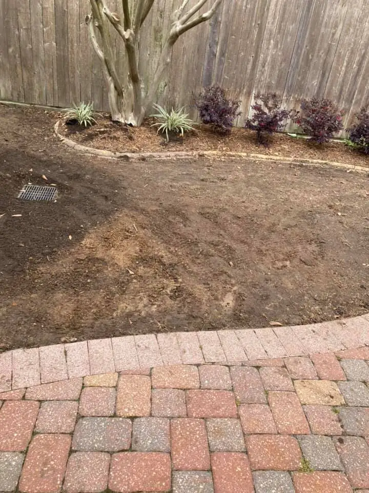 Beautiful landscaping flowerbeds with mulch crafted and installed by Southern Grounds, LLC in the greater new orleans area