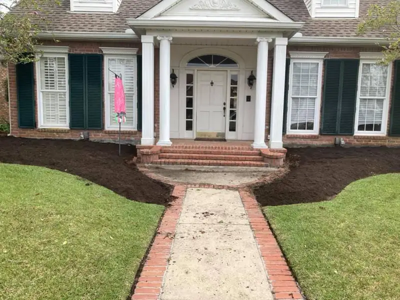 Beautiful landscaping flowerbeds with mulch crafted and installed by Southern Grounds, LLC in the greater new orleans area