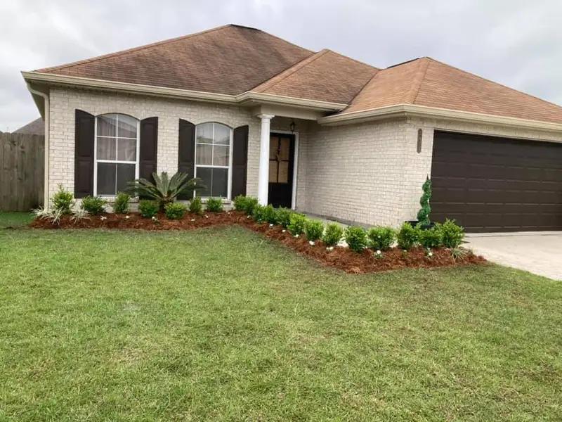 Beautiful landscaping flowerbeds with mulch crafted and installed by Southern Grounds, LLC in the greater new orleans area