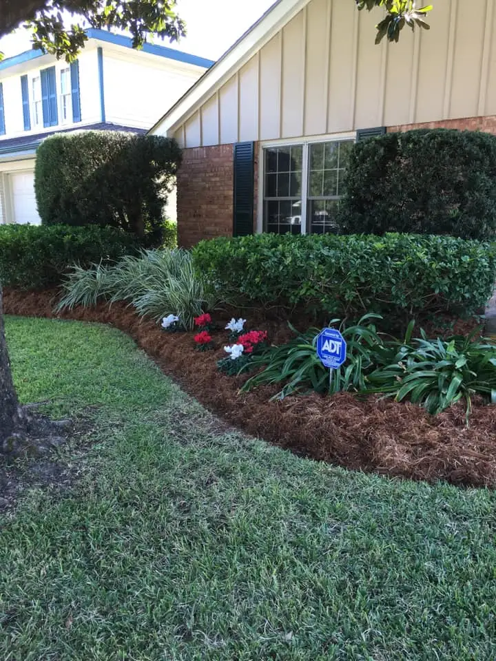 Beautiful landscaping flowerbeds with mulch crafted and installed by Southern Grounds, LLC in the greater new orleans area