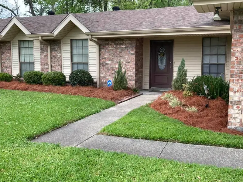 Beautiful landscaping flowerbeds with mulch crafted and installed by Southern Grounds, LLC in the greater new orleans area
